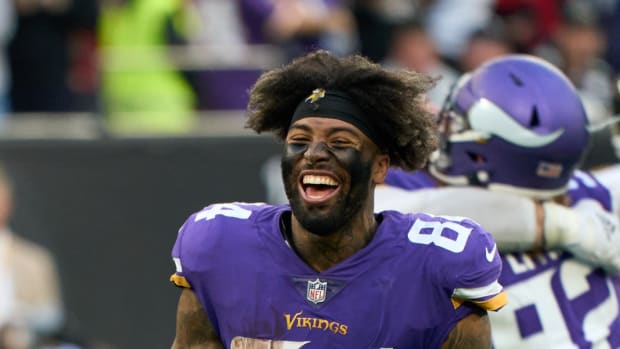 Oct 2, 2022; London, United Kingdom; Minnesota Vikings tight end Irv Smith Jr. (84) celebrate victory at the end of the second half of the NFL International Series game at Tottenham Hotspur Stadium. Mandatory Credit: Peter van den Berg-USA TODAY Sports